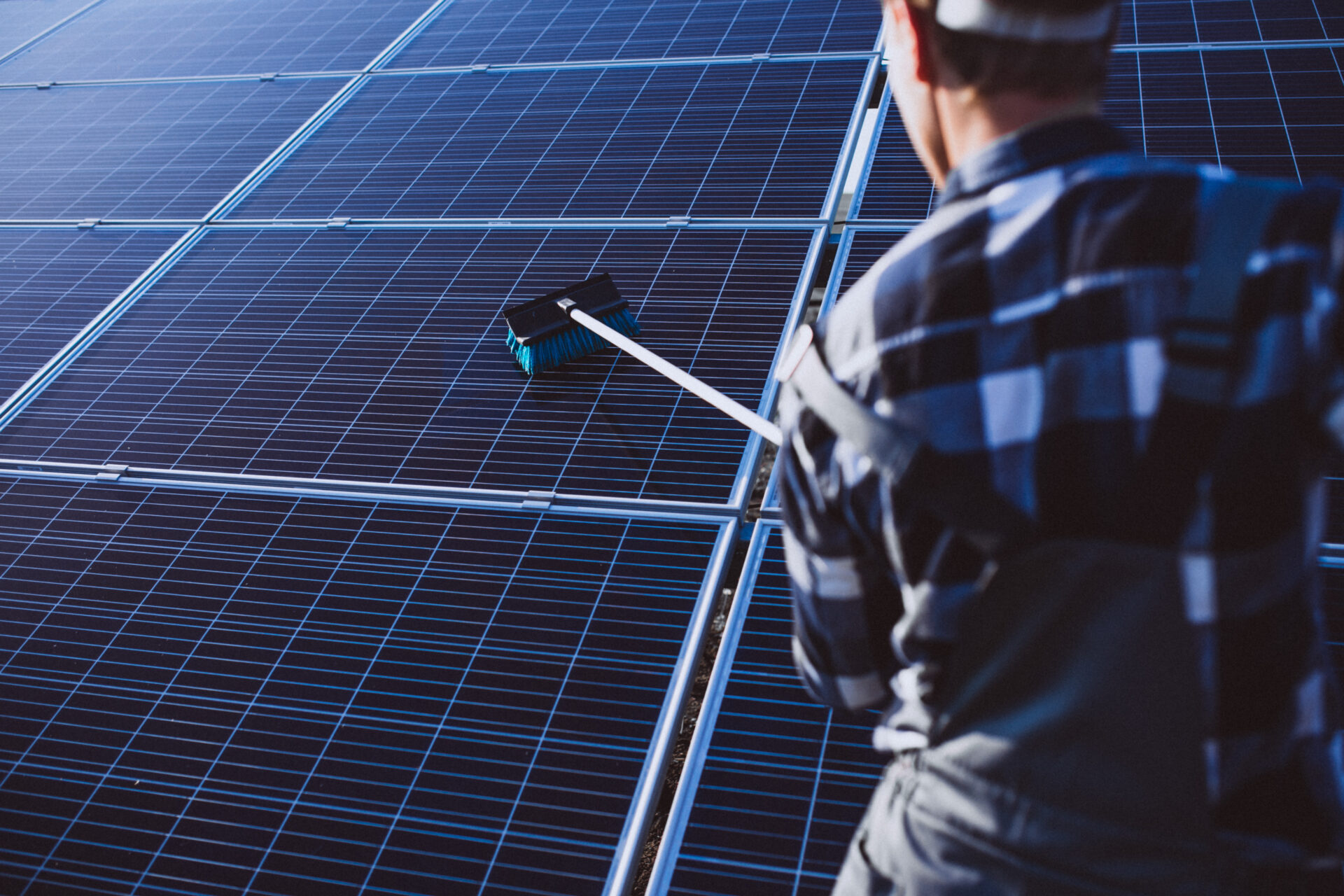Man Worker on Solar Pannels